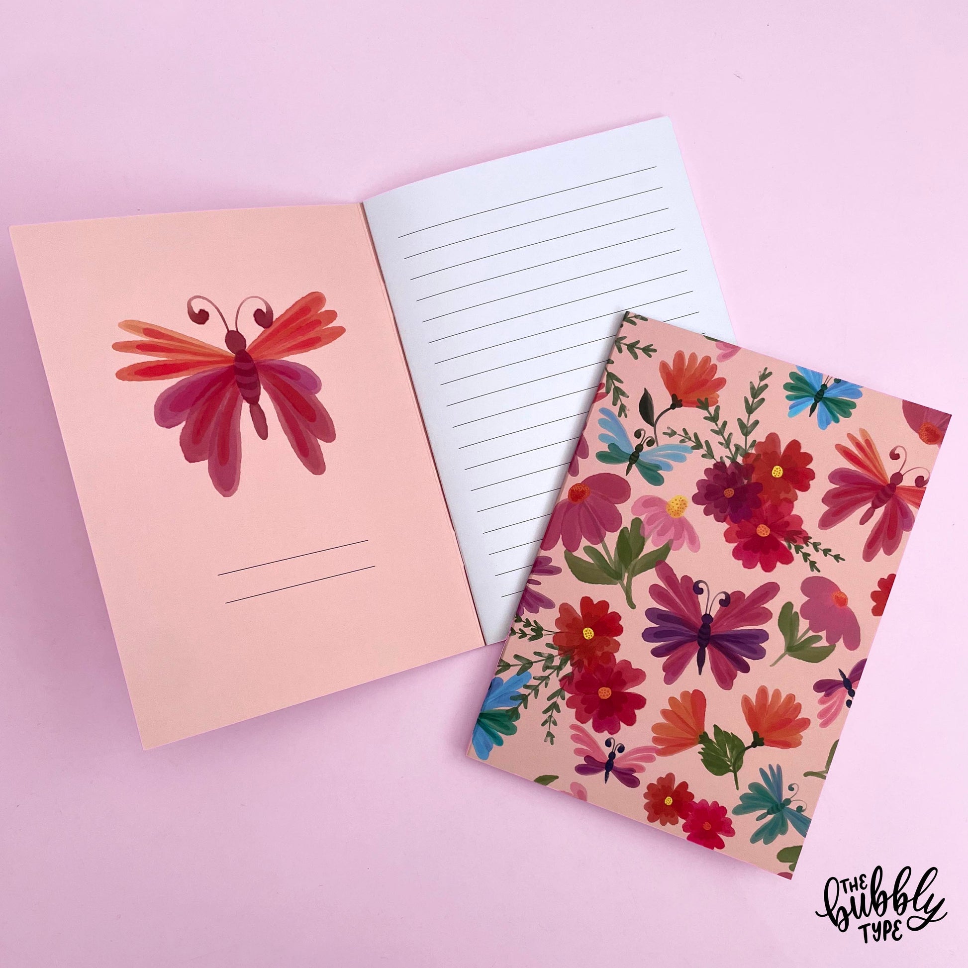 Handmade A5 notebook with flowers and butterflies pattern cover, featuring original artwork by Nicole Jayne for The Bubbly Type, 32 lined pages on 120gsm premium uncoated paper, eco-friendly recycled matte finish, ideal for notes, journaling, and gifts.