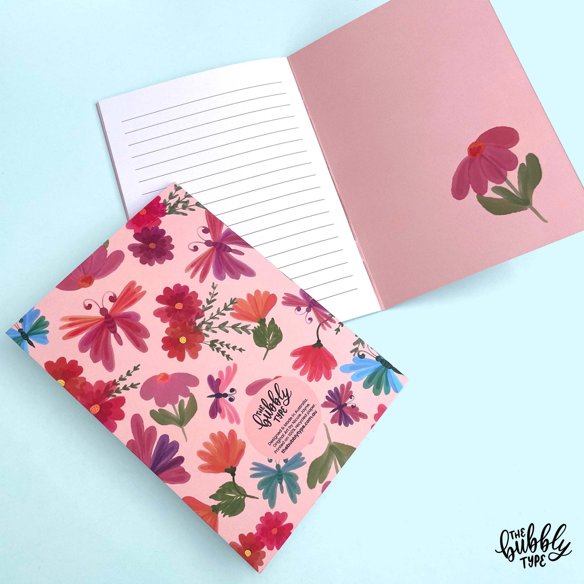 Handmade A5 notebook with flowers and butterflies pattern cover, featuring original artwork by Nicole Jayne for The Bubbly Type, 32 lined pages on 120gsm premium uncoated paper, eco-friendly recycled matte finish, ideal for notes, journaling, and gifts.