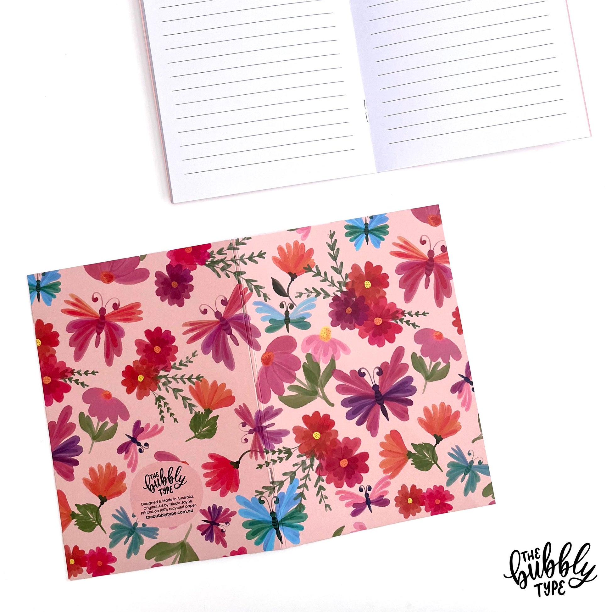 Handmade A5 notebook with flowers and butterflies pattern cover, featuring original artwork by Nicole Jayne for The Bubbly Type, 32 lined pages on 120gsm premium uncoated paper, eco-friendly recycled matte finish, ideal for notes, journaling, and gifts.